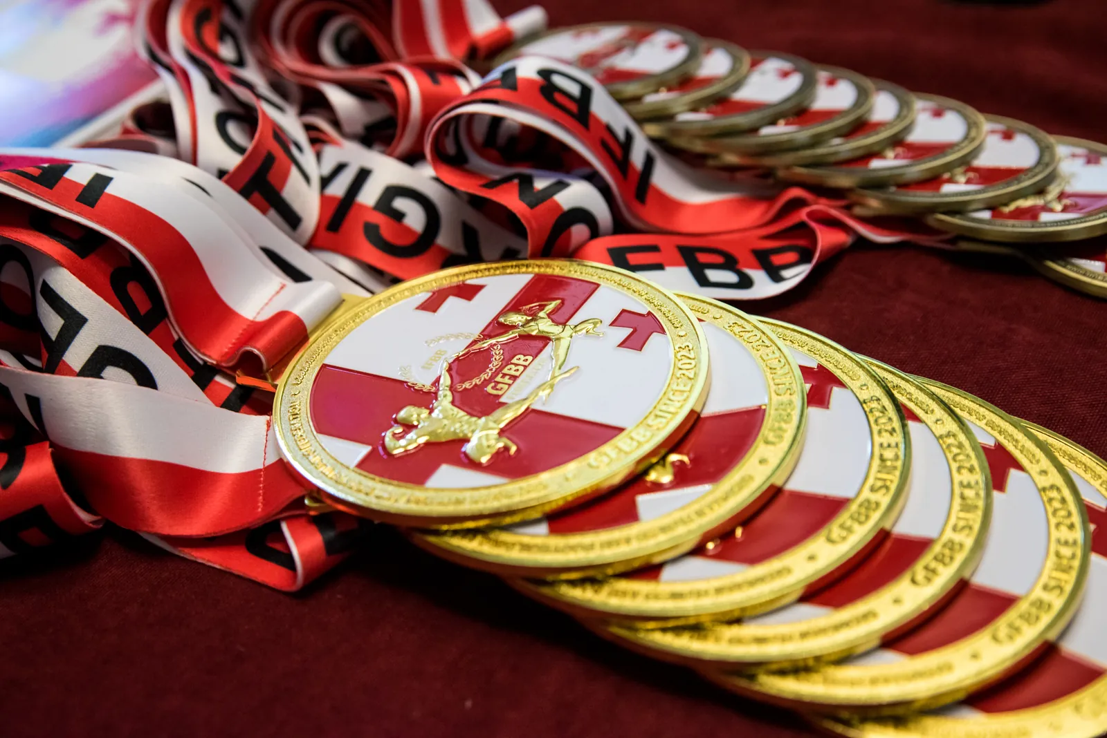 GFBB gold medals with Georgian flag ribbons
