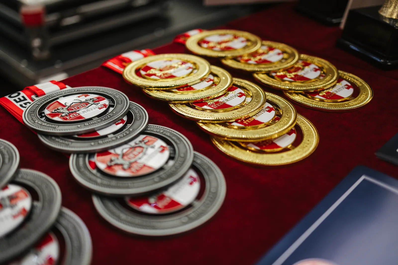 Gold and silver GFBB championship medals on the awards table