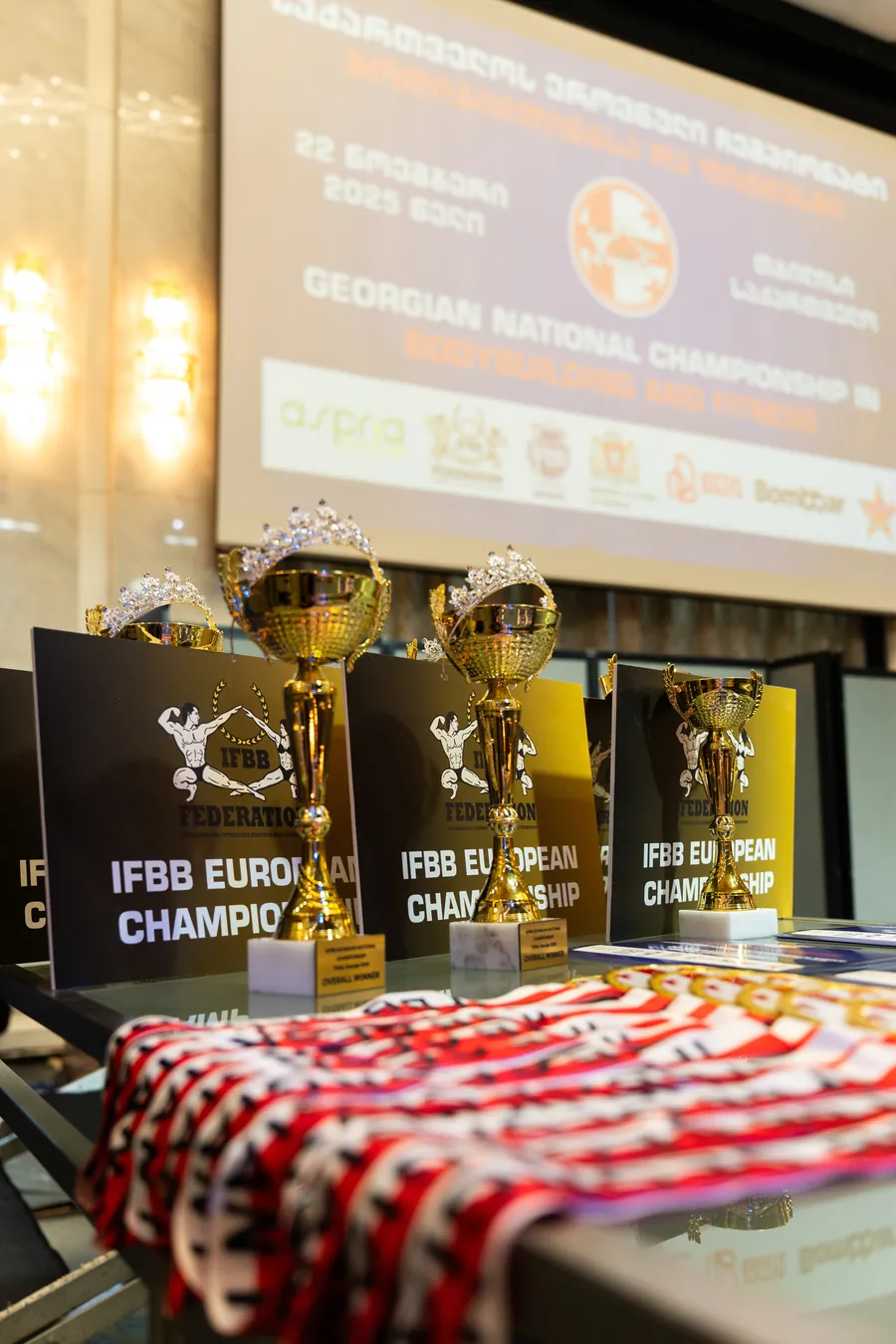 Overall winner cups in front of the championship screen